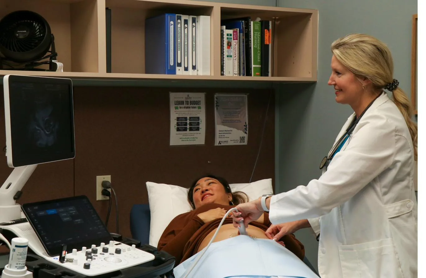 Provider performing an ultrasound at Alliance Women's Clinic