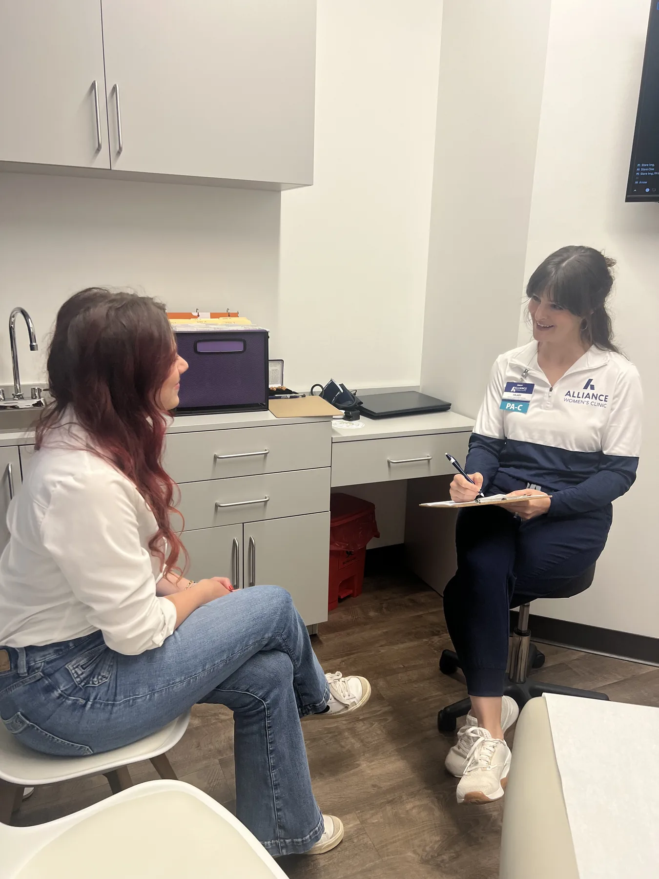 An Alliance case manager talking with a client